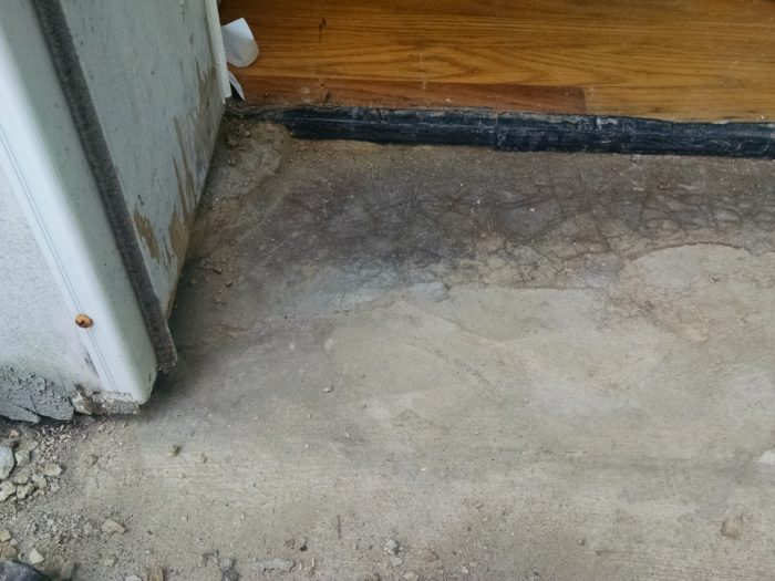 How to repair the concrete sill under our front door
